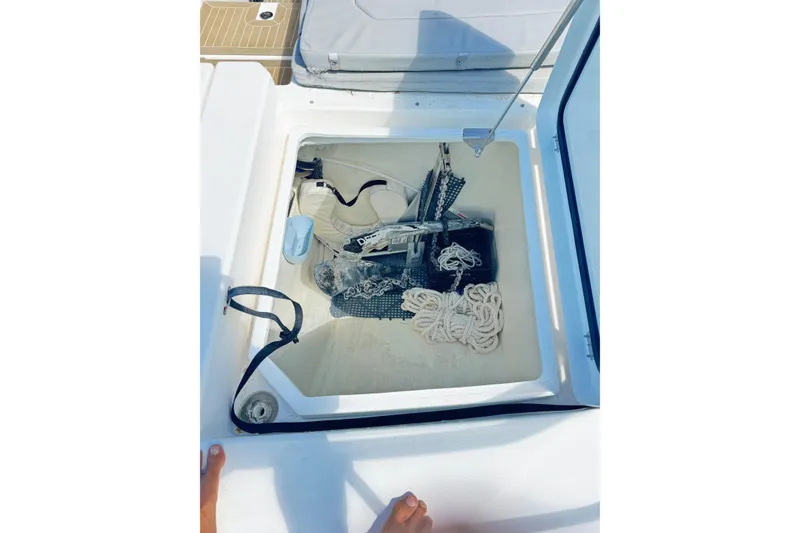 Slide: The Image of Storage compartment on a 2021 Leopard 53 Powercat, containing ropes and boating equipment. - 9