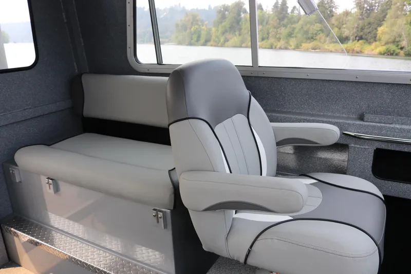 Slide: The Image of Interior of 2026 KingFisher 2425 Escape HT boat with gray seating and river view. - 11