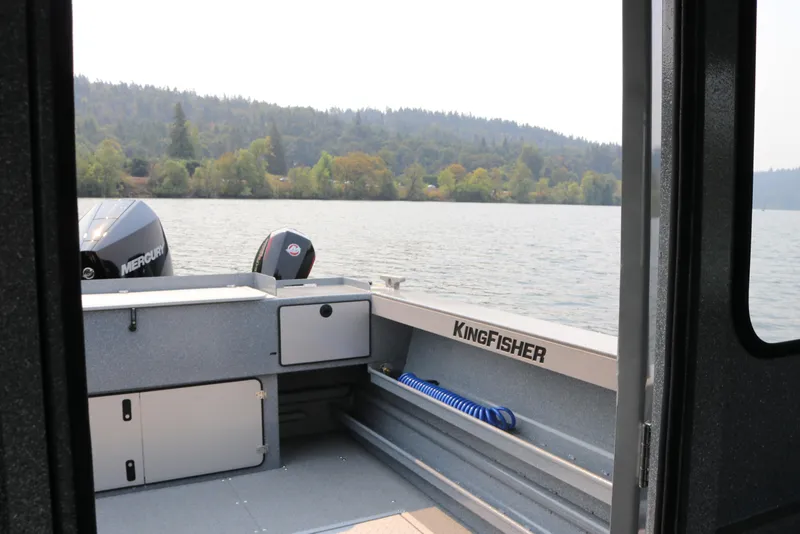Slide: The Image of 2026 KingFisher 2425 Escape HT boat interior with scenic lake view. - 20