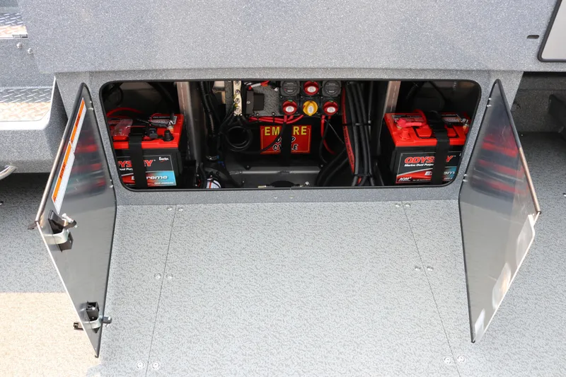 Slide: The Image of Battery compartment of 2026 KingFisher 2425 Escape HT boat, featuring Odyssey batteries. - 21