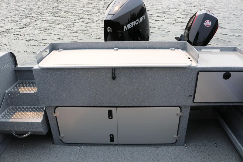 Slide: The Image of 2026 KingFisher 2425 Escape HT boat with Mercury outboard motors on water. - 26