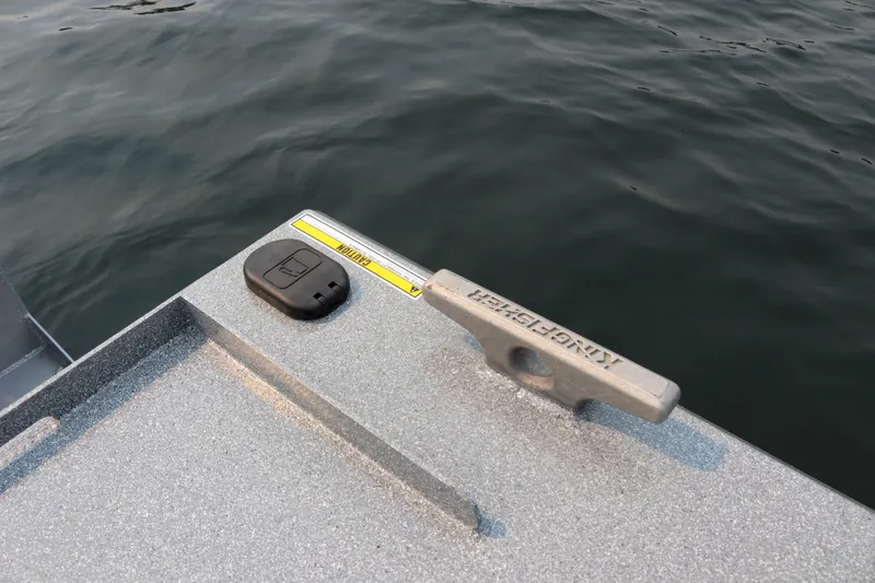 Slide: The Image of 2026 KingFisher 2425 Escape HT boat cleat and control panel by the water. - 30