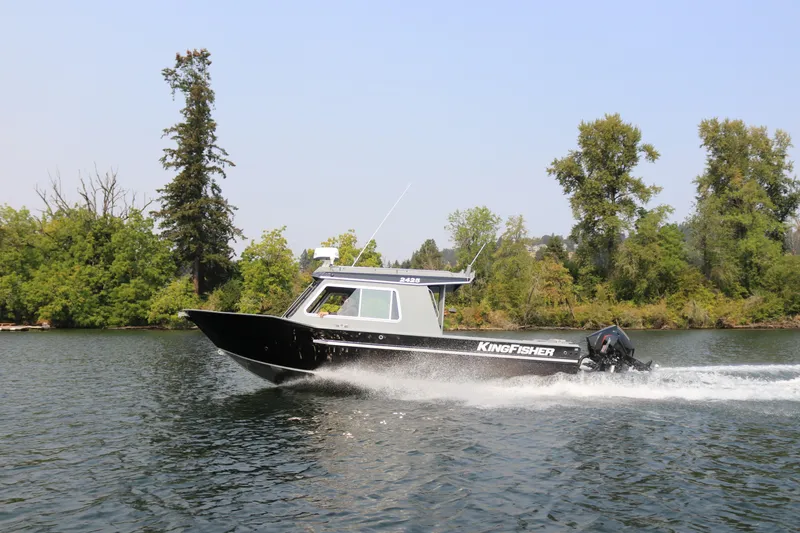 Slide: The Image of KingFisher 2425 Escape HT boat on a river, 2026 model. - 38