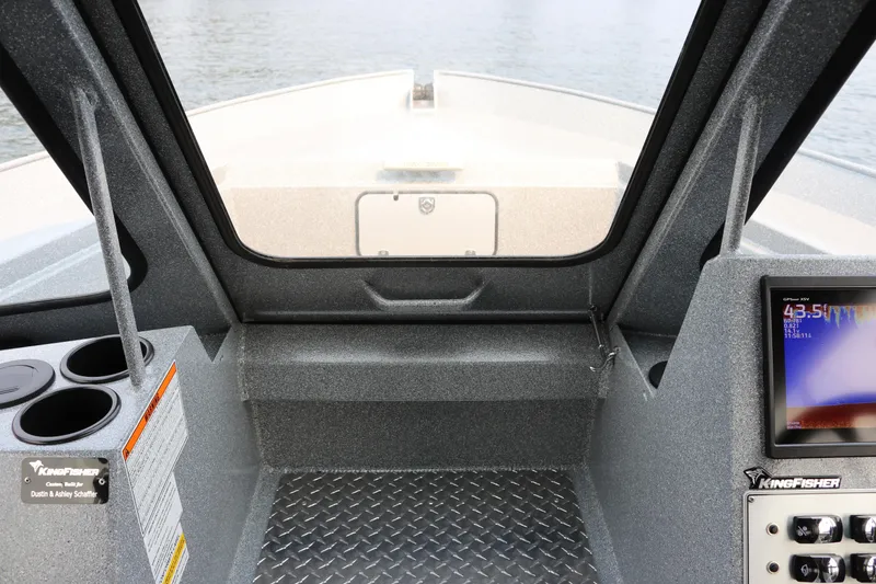 Slide: The Image of 2026 KingFisher 2425 Escape HT boat interior with dashboard and cup holders. - 5