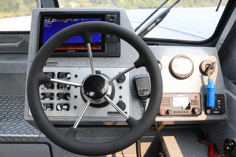 Slide: The Image of Helm of 2026 KingFisher 2425 Escape HT with Garmin navigation system and controls. - 7