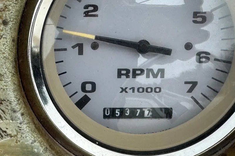 Slide: The Image of Close-up of a tachometer showing 5377 RPM, Crest II LM 2003. - 10