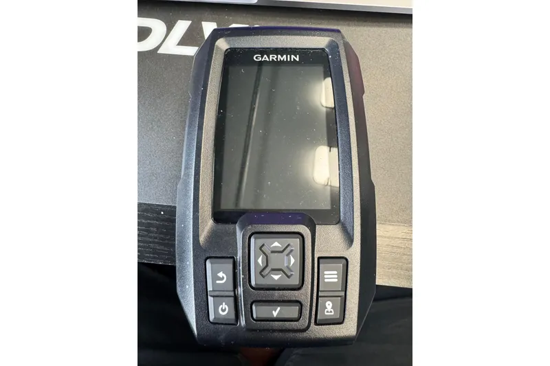 Slide: The Image of Garmin device with buttons on a table, model Crest II LM 2003. - 11