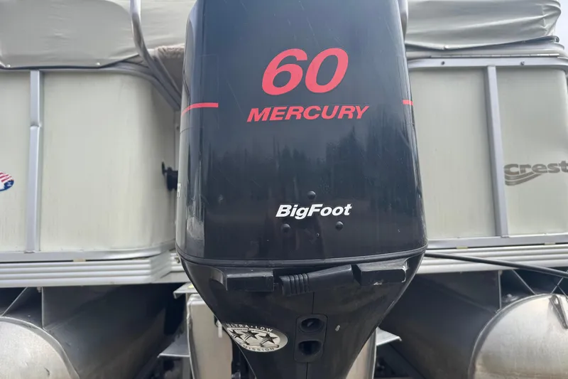 Slide: The Image of Mercury 60 BigFoot outboard motor on a Crest II LM boat. - 6