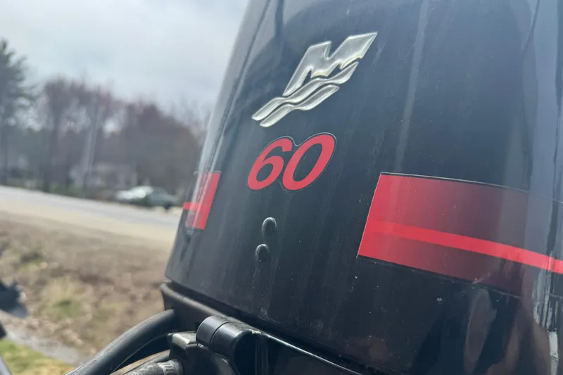 Slide: The Image of Close-up of a Crest II LM 60 horsepower outboard motor, year 2003. - 7