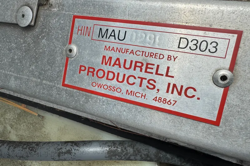 Slide: The Image of Metal plate from Maurell Products, Inc. with HIN number. - 8
