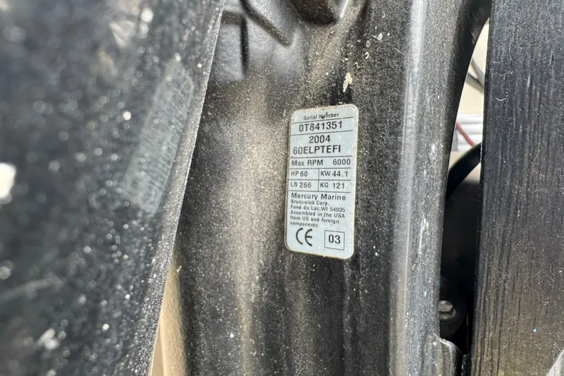 Slide: The Image of Close-up of a Mercury Marine engine label with specifications. - 9