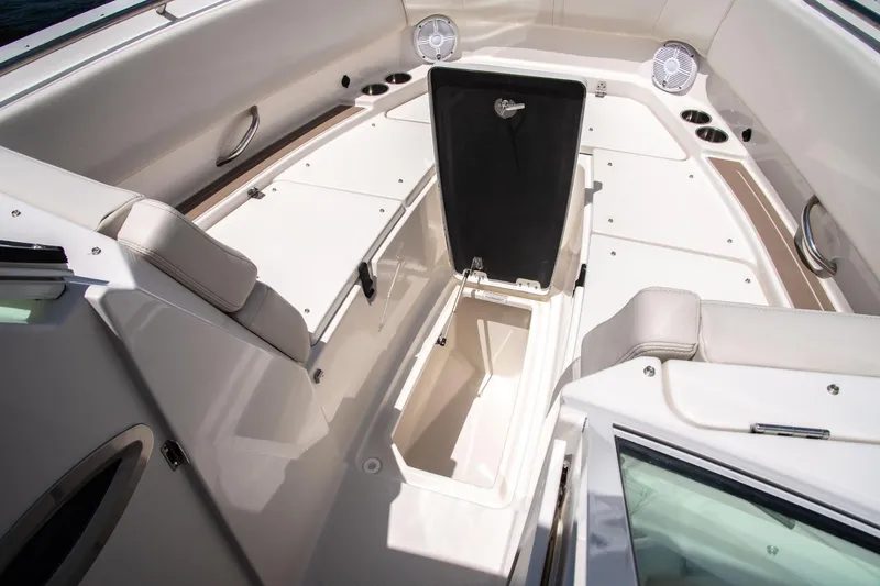 Slide: The Image of Interior view of 2027 Sailfish 276 DC boat, featuring storage compartments and seating. - 11