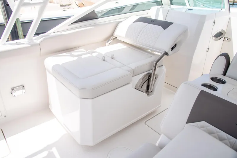 Slide: The Image of Luxurious seating on 2027 Sailfish 276 DC boat, featuring white upholstery and modern design. - 16