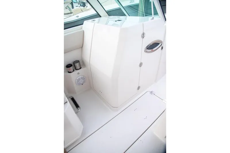 Slide: The Image of Interior view of 2027 Sailfish 276 DC boat, featuring sleek white design and modern fixtures. - 20