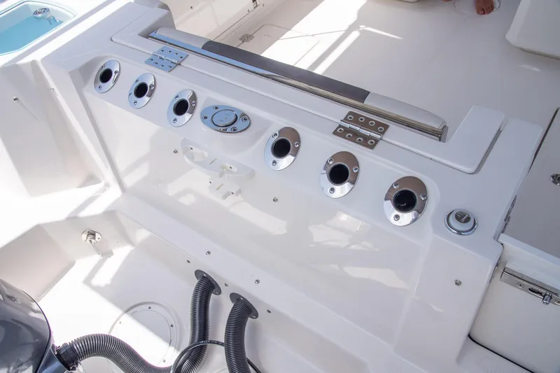 Slide: The Image of Sailfish 276 DC 2027 boat interior with rod holders and storage compartments. - 22