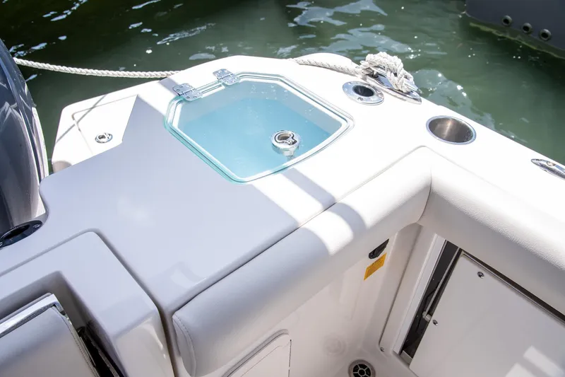 Slide: The Image of Sailfish 276 DC 2027 boat interior with livewell and cup holder. - 24