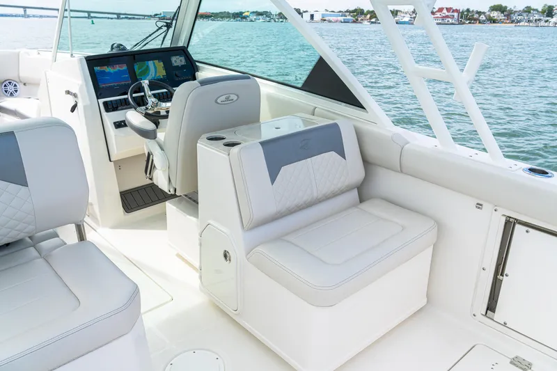 Slide: The Image of Interior of 2027 Sailfish 276 DC boat with modern seating and navigation controls. - 28