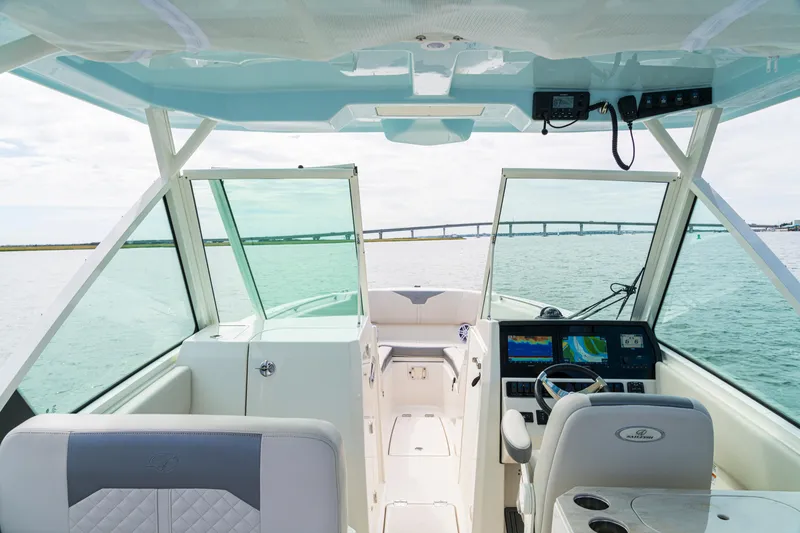 Slide: The Image of Interior view of 2027 Sailfish 276 DC boat cockpit with navigation screens and steering wheel. - 4