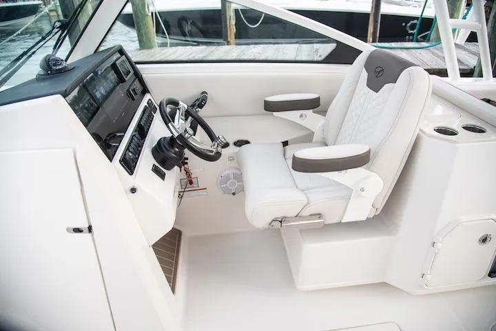 Slide: The Image of 2027 Sailfish 276 DC boat interior with modern helm and comfortable seating. - 5