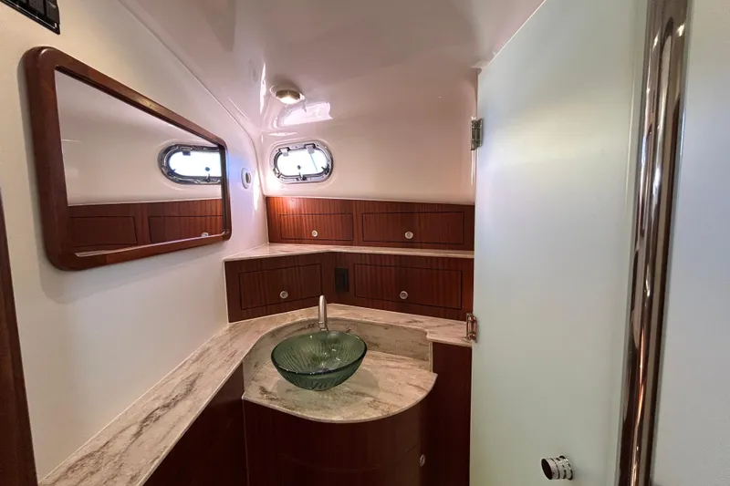 Slide: The Image of Luxurious bathroom interior of 2018 Pursuit OS 385 Offshore yacht with modern fixtures. - 20