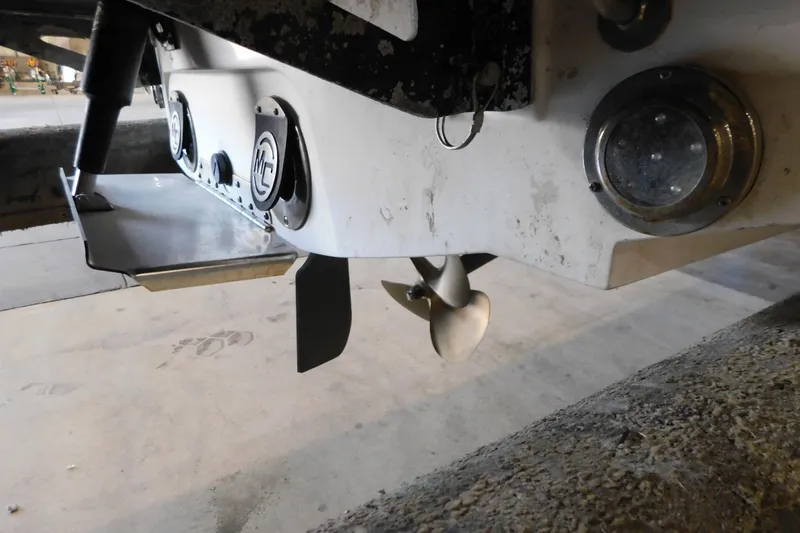 Slide: The Image of Rear view of a 2009 MasterCraft X55 boat showing propeller and trim tabs. - 11