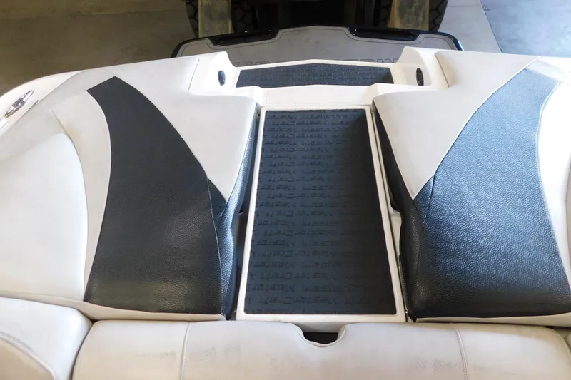 Slide: The Image of 2009 MasterCraft X55 boat interior with black and white upholstery design. - 21