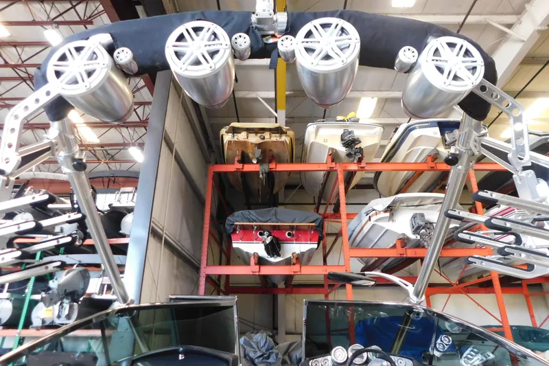 Slide: The Image of Indoor storage of 2009 MasterCraft X55 boats with mounted speakers and equipment. - 22