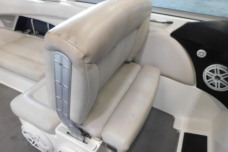 Slide: The Image of 2009 MasterCraft X55 boat interior with beige seating and speaker system. - 28