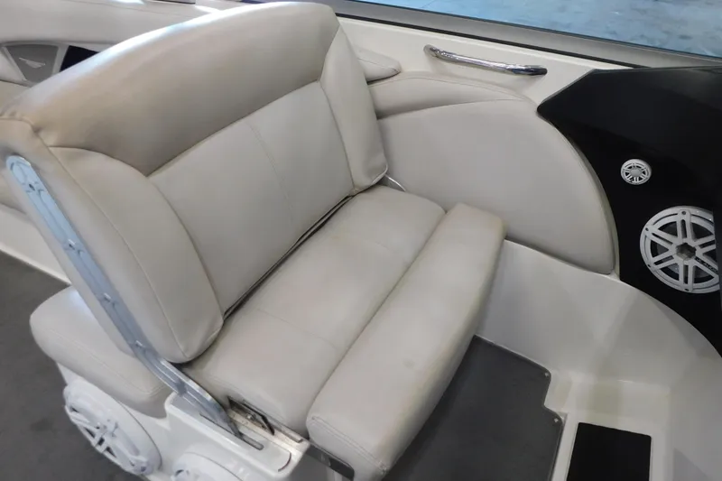 Slide: The Image of 2009 MasterCraft X55 boat interior with beige seating and speaker system. - 30