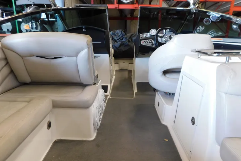 Slide: The Image of Interior of a 2009 MasterCraft X55 boat, featuring seating and dashboard controls. - 33