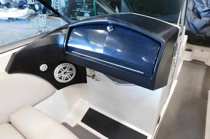 Slide: The Image of 2009 MasterCraft X55 boat interior with speaker and storage compartment. - 35