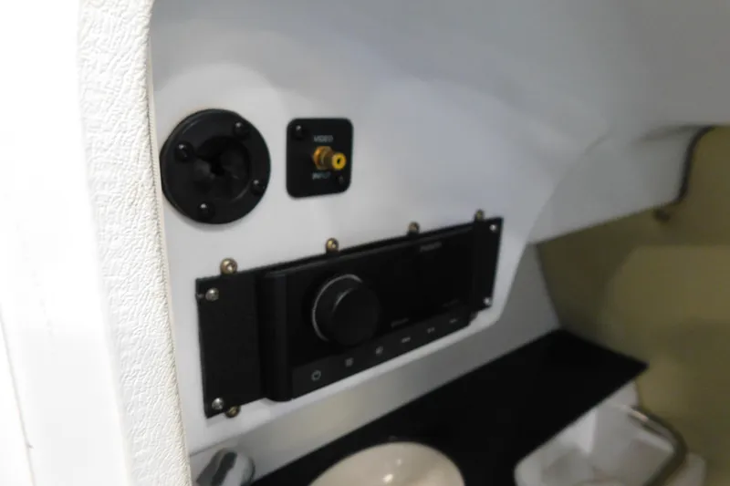 Slide: The Image of 2009 MasterCraft X55 boat interior control panel with video input and audio controls. - 37