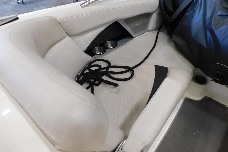 Slide: The Image of 2009 MasterCraft X55 boat interior with white seating and black rope. - 39