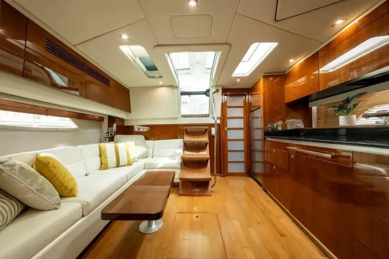 Slide: The Image of Luxurious interior of 2009 Sea Ray 43 Sundancer yacht with elegant wood finishes and plush seating. - 17