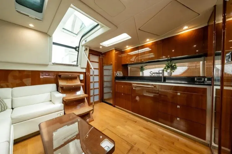 Slide: The Image of Luxurious interior of 2009 Sea Ray 43 Sundancer yacht with elegant wood finishes and modern design. - 18
