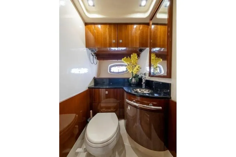 Slide: The Image of Luxurious bathroom interior of 2009 Sea Ray 43 Sundancer yacht with wood cabinetry and floral decor. - 22