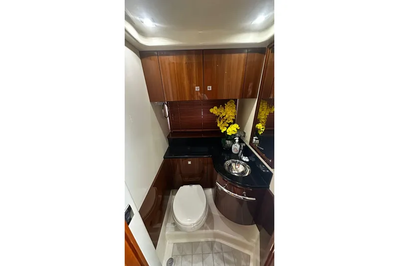 Slide: The Image of Luxurious bathroom in 2009 Sea Ray 43 Sundancer yacht with wood cabinetry and modern fixtures. - 24