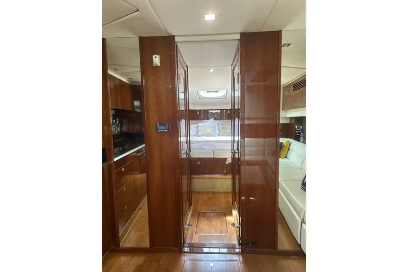 Slide: The Image of Luxurious interior of 2009 Sea Ray 43 Sundancer yacht with wood finishes and cozy seating. - 25
