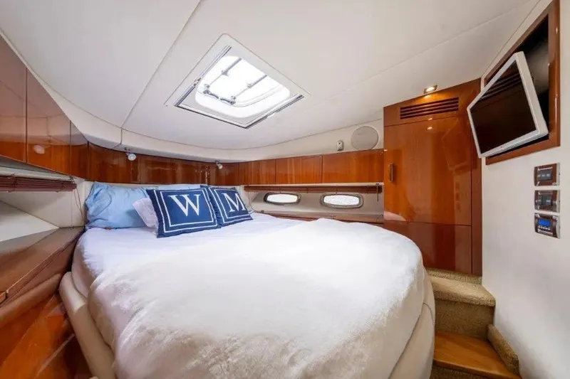 Slide: The Image of Luxurious cabin interior of 2009 Sea Ray 43 Sundancer yacht with cozy bed and TV. - 27