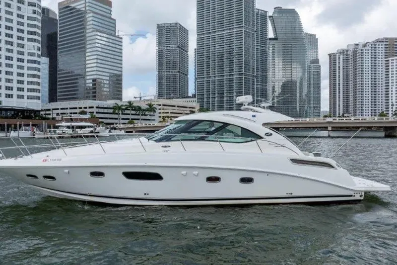Slide: The Image of 2009 Sea Ray 43 Sundancer yacht cruising near city skyscrapers. - 3