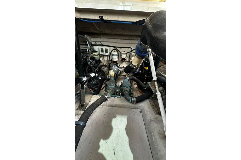 Slide: The Image of Engine compartment of a 2009 Sea Ray 43 Sundancer boat, showcasing mechanical components. - 34
