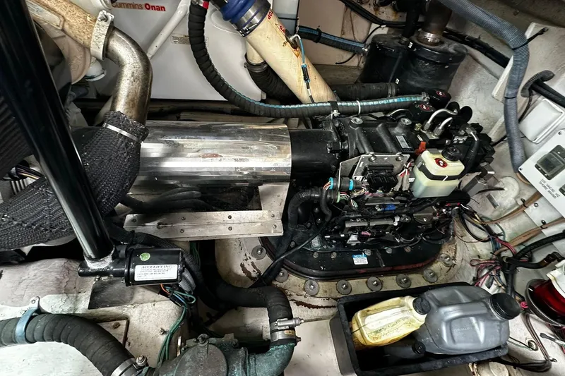 Slide: The Image of Engine room of a 2009 Sea Ray 43 Sundancer with visible components and wiring. - 36
