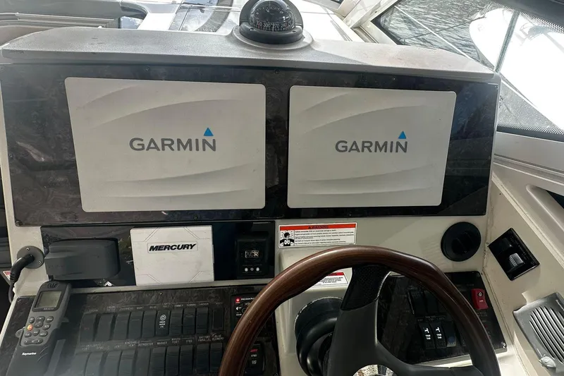 Slide: The Image of Cockpit of 2009 Sea Ray 43 Sundancer with Garmin navigation displays. - 37
