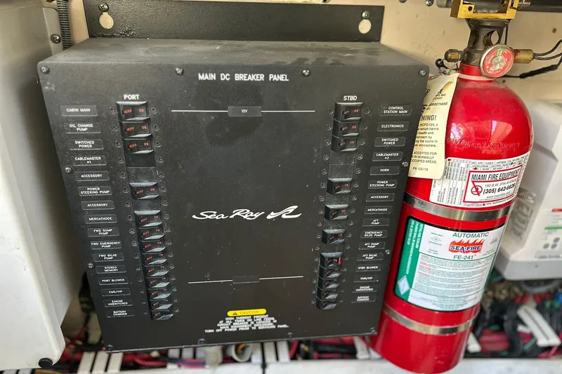 Slide: The Image of Main DC breaker panel and fire extinguisher on 2009 Sea Ray 43 Sundancer yacht. - 38