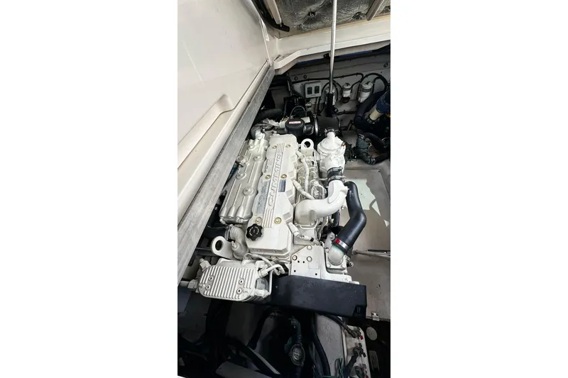 Slide: The Image of Engine compartment of a 2009 Sea Ray 43 Sundancer boat, showcasing a Cummins engine. - 39