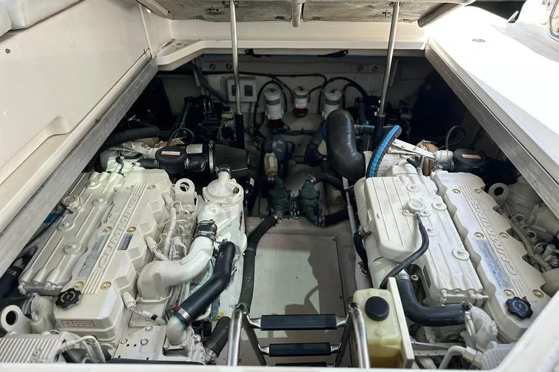 Slide: The Image of Engine compartment of a 2009 Sea Ray 43 Sundancer boat, featuring dual Cummins engines. - 41