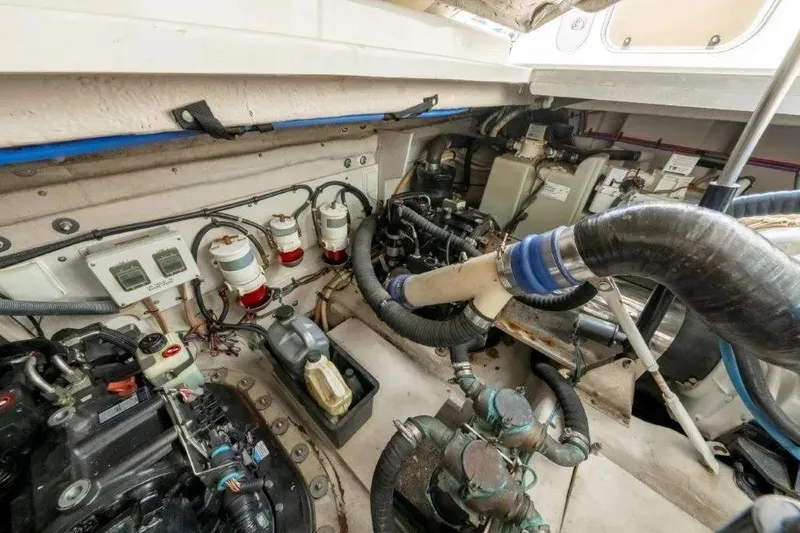 Slide: The Image of Engine room of 2009 Sea Ray 43 Sundancer with visible components and wiring. - 42