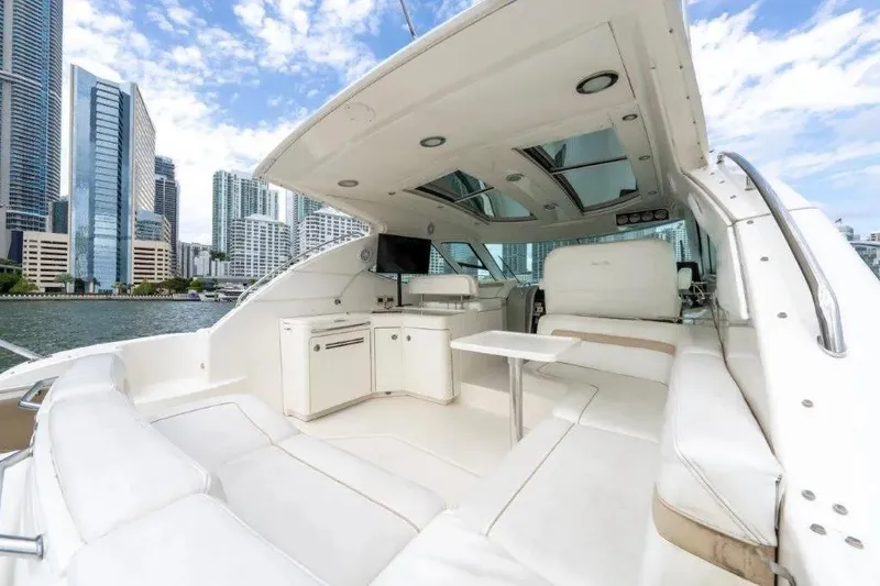 Slide: The Image of Luxurious 2009 Sea Ray 43 Sundancer yacht interior with city skyline backdrop. - 45