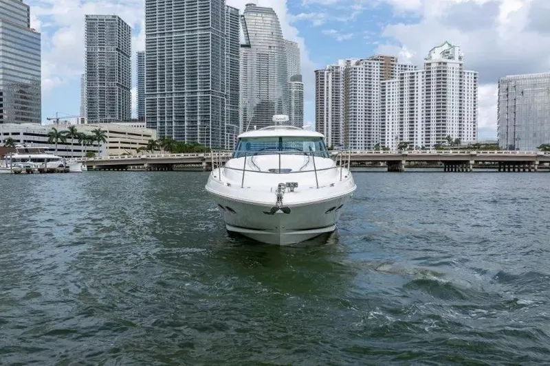 Slide: The Image of 2009 Sea Ray 43 Sundancer yacht cruising in urban waterfront with skyscrapers. - 58