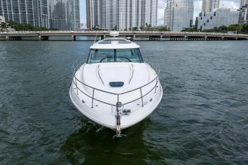 Slide: The Image of 2009 Sea Ray 43 Sundancer yacht cruising in urban waterfront setting. - 59